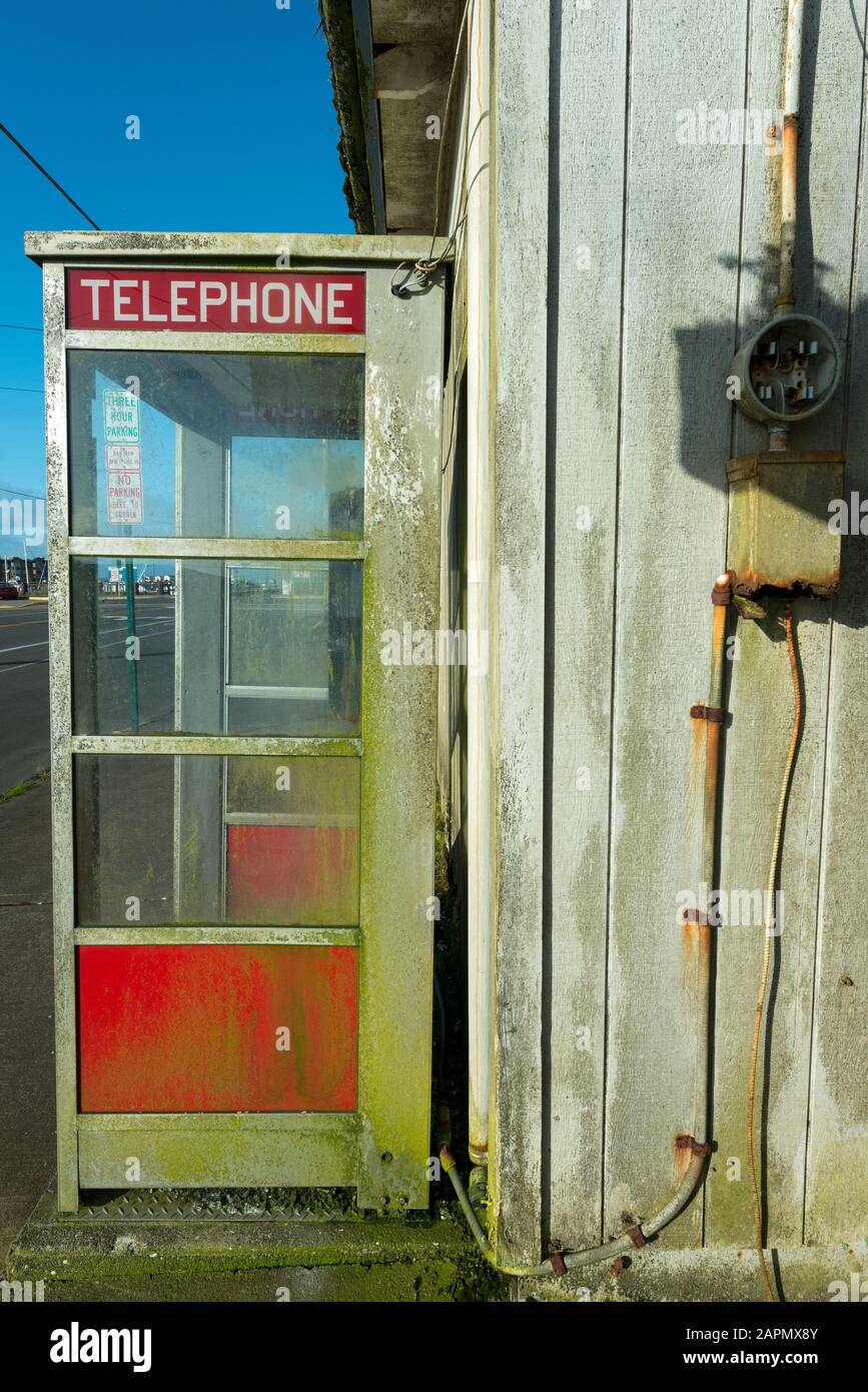 A Crusty Red Phone Booth in Westport, Washington, USA Stock Photo