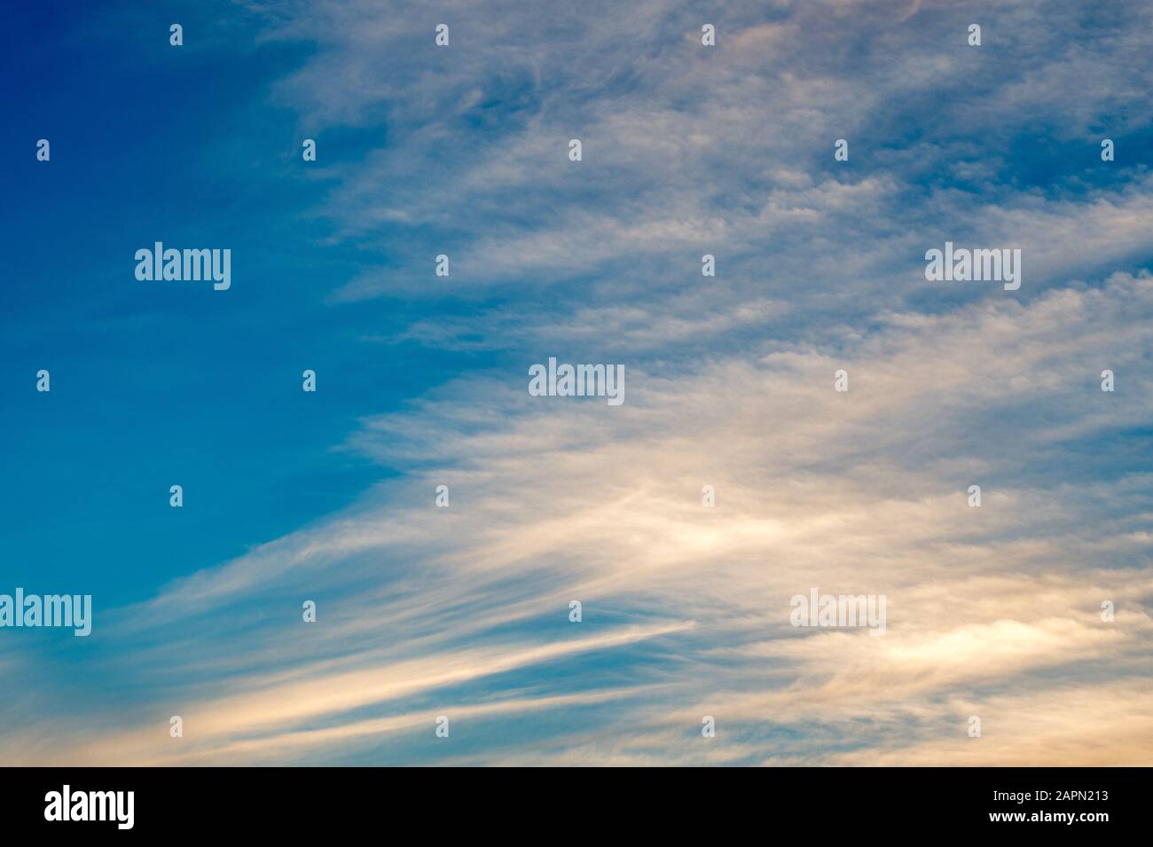 Low angle shot of white clouds in a clear blue sky with a scenery of ...