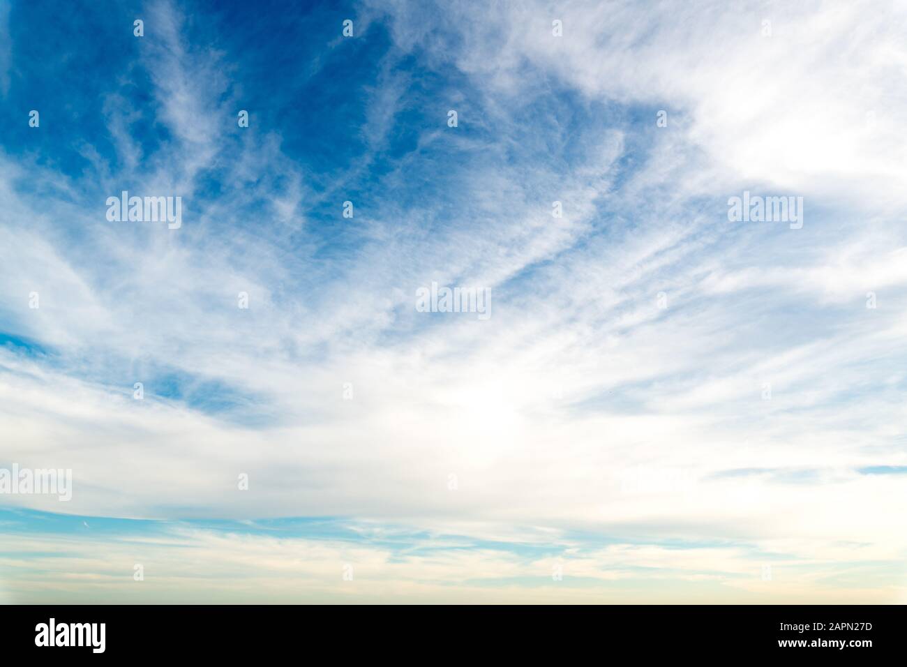 Low angle shot of white clouds in a clear blue sky Stock Photo - Alamy