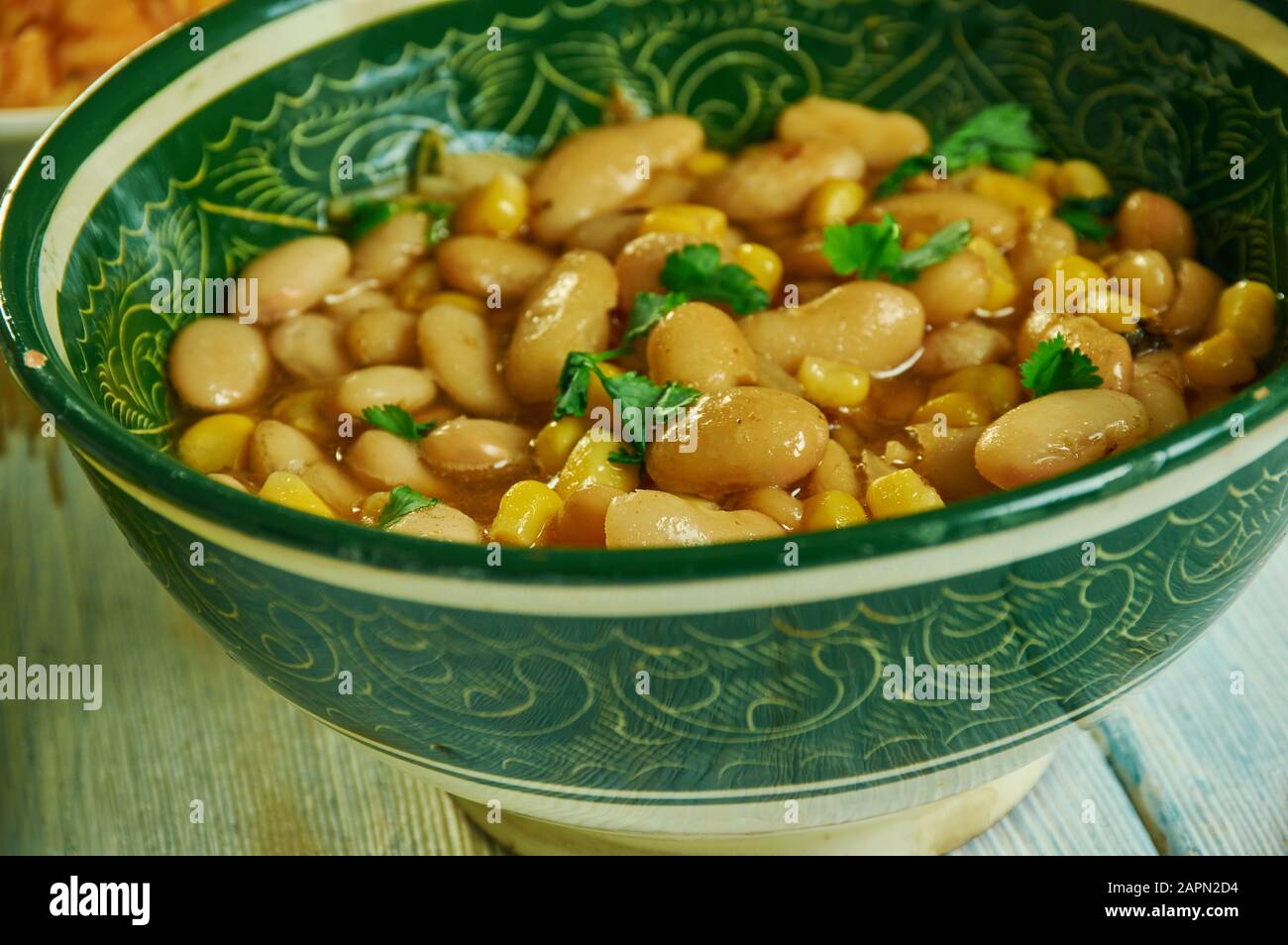 Githeri, maize and beans are mixed together in a sufuria,  Kenyan cuisine, Traditional assorted African dishes, Top view. Stock Photo