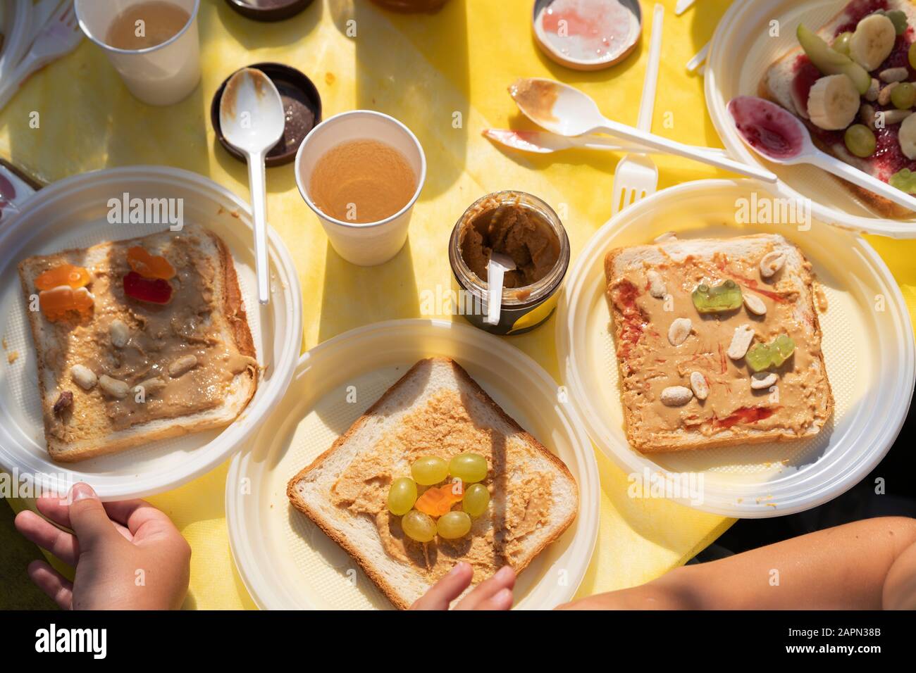 Edible sandwich made of white wheat bread, jam, bananas and marmalade Stock Photo Alamy