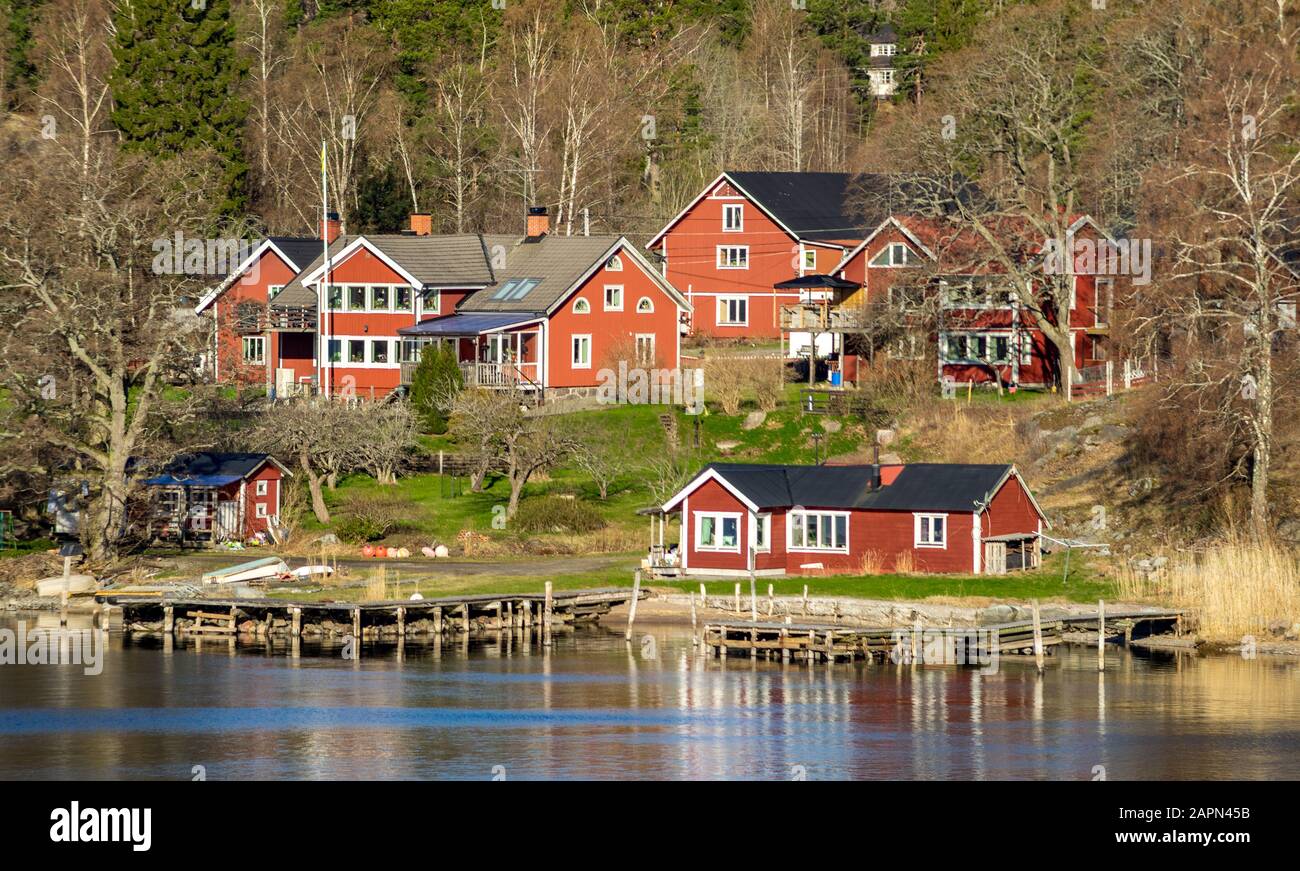 Picturesque summer houses painted in traditional falun red on dwellings