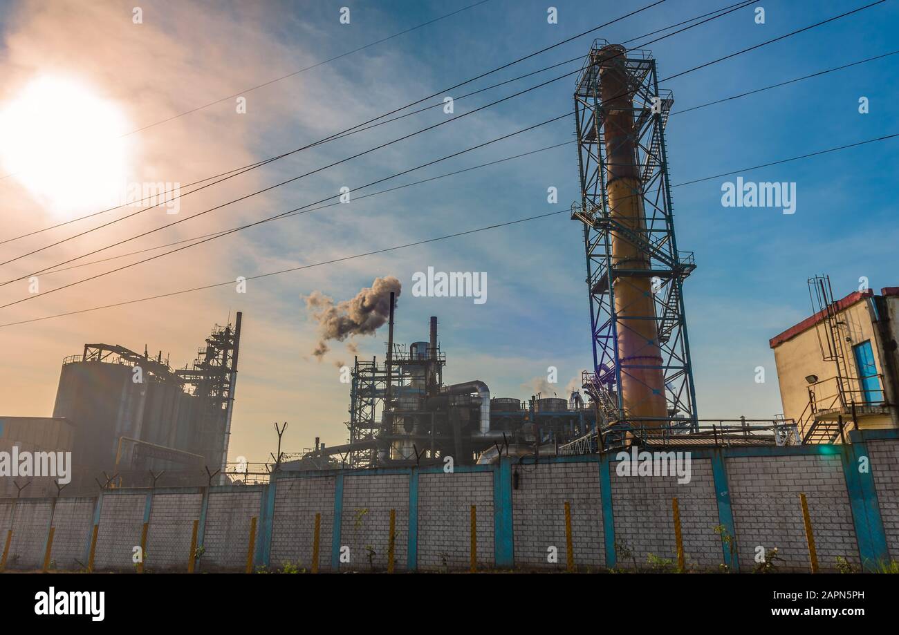 Polluted smoke emitted from the chimney of a Small scale Industry. Stock Photo