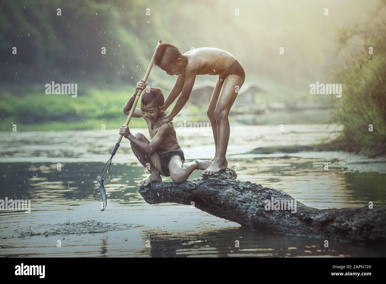 Boy fishing at the river Stock Photo - Alamy