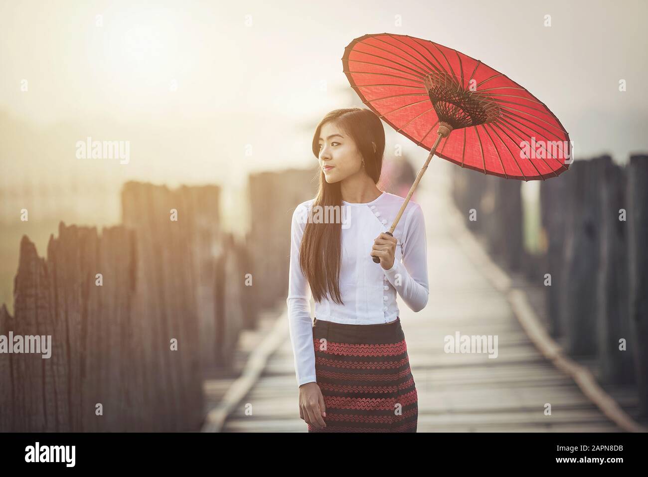 Burmese women in Burmese Traditional dress with red umbrella on U bein bridge Mandalay, Myanmar Stock Photo - Alamy Burmese women in Burmese Traditional dress with red umbrella on U bein bridge Mandalay, Myanmar Stock Photo - Alamy