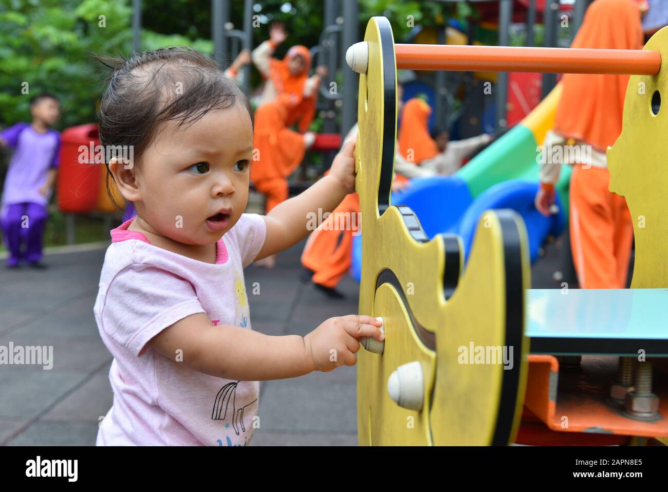 1 years, asia face, baby girl, playing in the park, public space Stock Photo