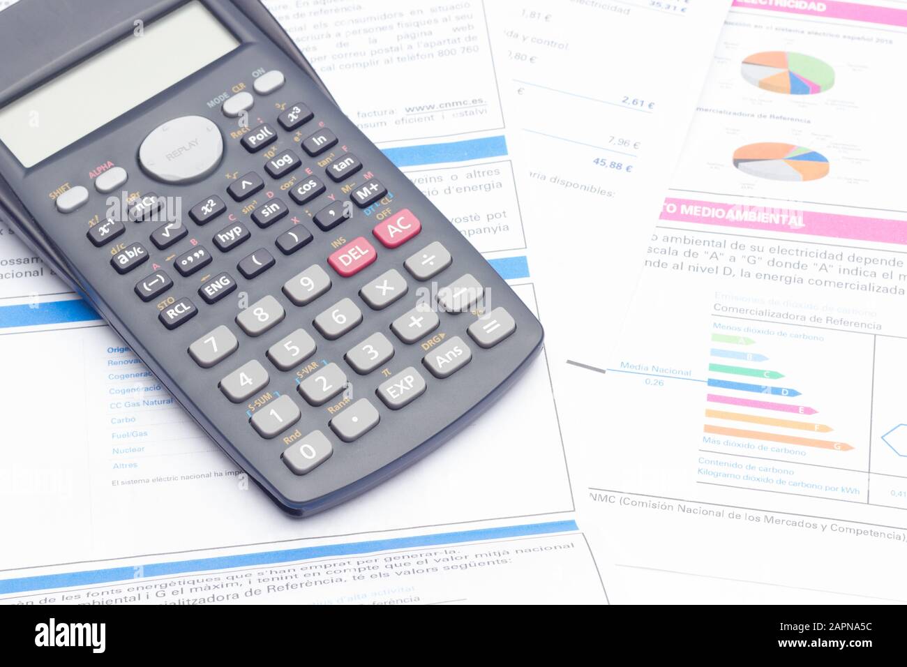 Papers, glasses and calculator to make calculations of the invoices we receive, to make graphs and statistics of our expenses or benefits. scientific Stock Photo