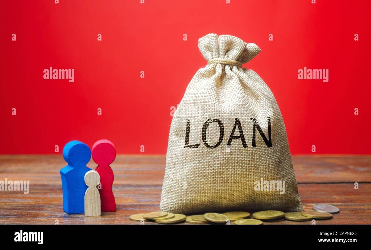 Money bag with the word Loan and family. The concept of accumulation of money for the payment of credit debt. Mortgage lending. Saving. Family budget Stock Photo