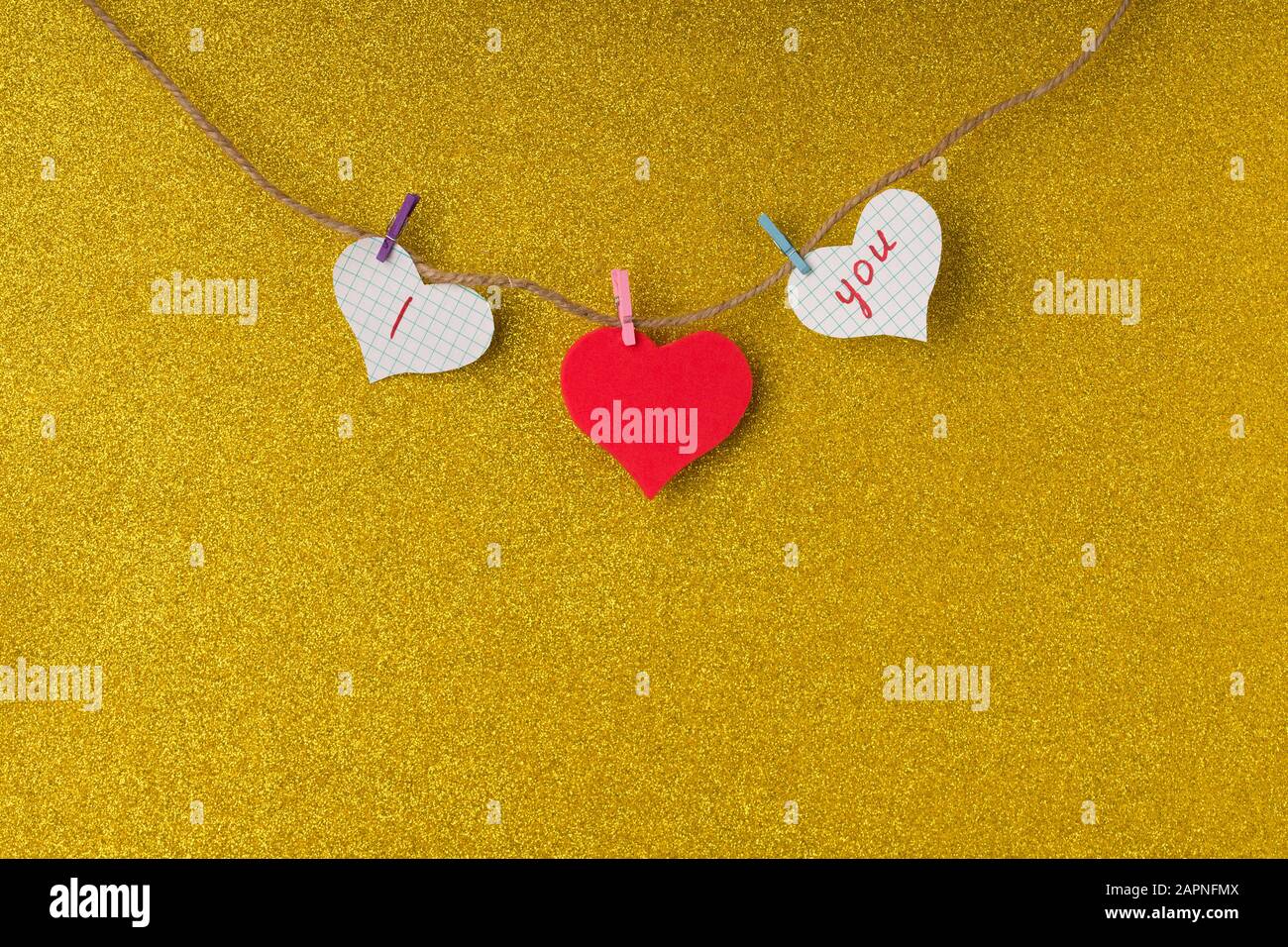Red paper hearts hanging on the rope in valentine day concept Stock ...