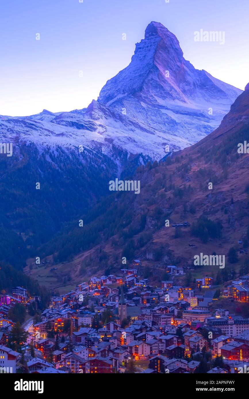 Zermatt, Switzerland town night aerial view and Matterhorn snow peak in
