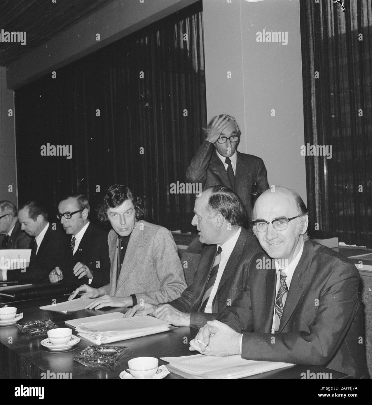 Wage consultation between employees- and employers' organisations in The Hague  From left to right Bartels (VNO), Kok (NVV), Pels (secretary Stichting van de Arbeid) Spit (NKV) and standing on background Lanser (CNV) Date: 7 November 1973 Location: The Hague, Zuid-Holland Keywords: wage consultation, autumn consultation, trade unions, employers' organisations Personal name: Bartels, J., Kok, W., Lanser, Jan, Pels, S., Spit, W. Stock Photo