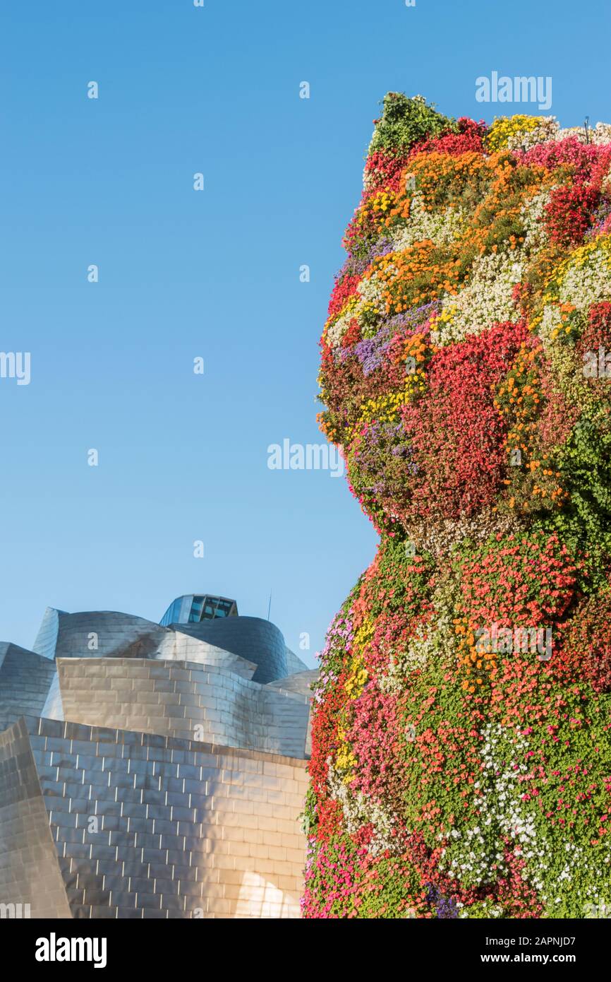 Puppy by Jeff Koons, a large floral dog outside the entrance to the Guggenheim in Bilbao, Spain Stock Photo