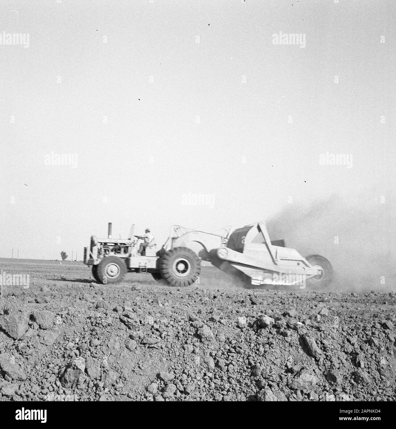 mining, tillage, leveling, shaving, workers, scrapers Date: November 1960 Keywords: workers, squirts, leveling, tillage, mining, extrination, scrapers Stock Photo