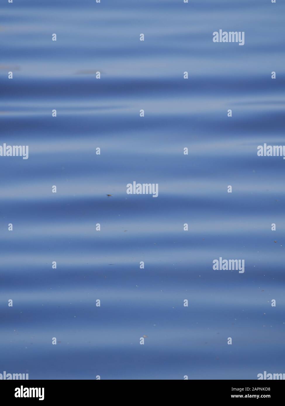 Blue water surface with waves, natural background photo. Stock Photo