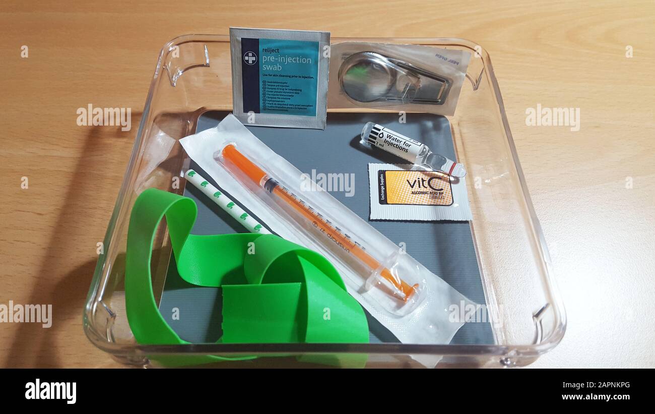 A needle and other instruments required to inject heroin at a drugs consumption room - where users take heroin under medical supervision - at Colston Hall in Bristol. Transform Drug Policy Foundation has set up the mock room as part of a Bristol-based conference discussing drug policy and reform. Stock Photo