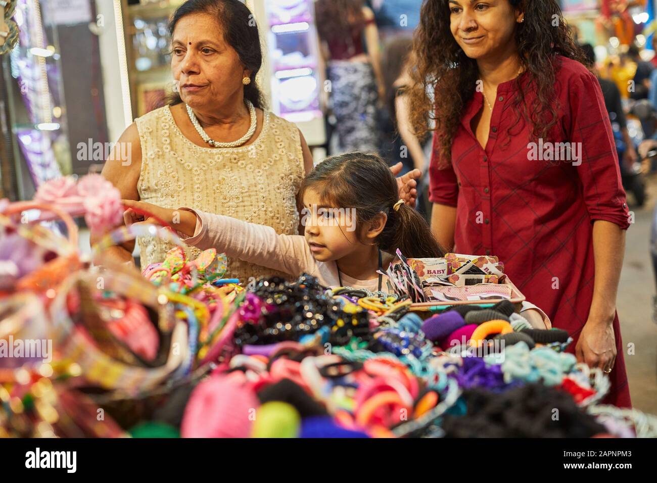 Family of three shopping at bazaar Stock Photo
