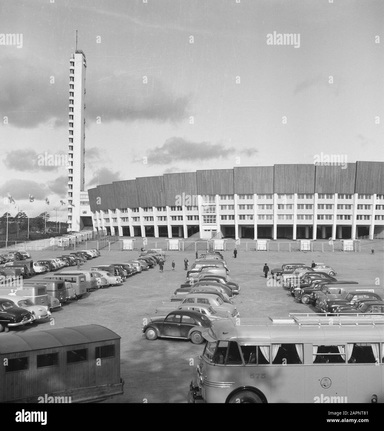 buildings, parking lots, people, cars Date: undated Keywords: cars, buildings, people, parking spaces Stock Photo