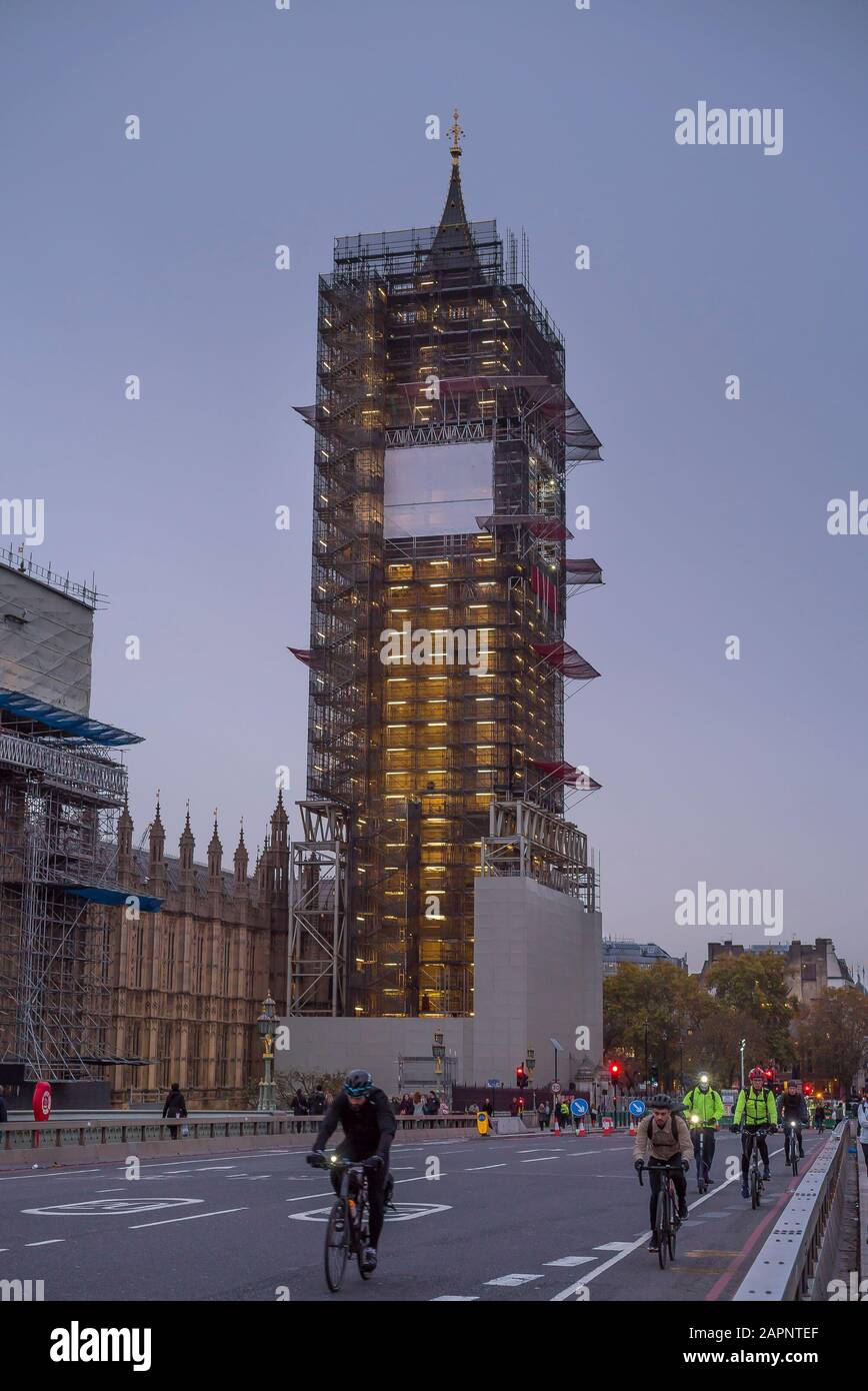 Evening view of Big Ben clock tower, London, UK covered in scaffolding. Stock Photo
