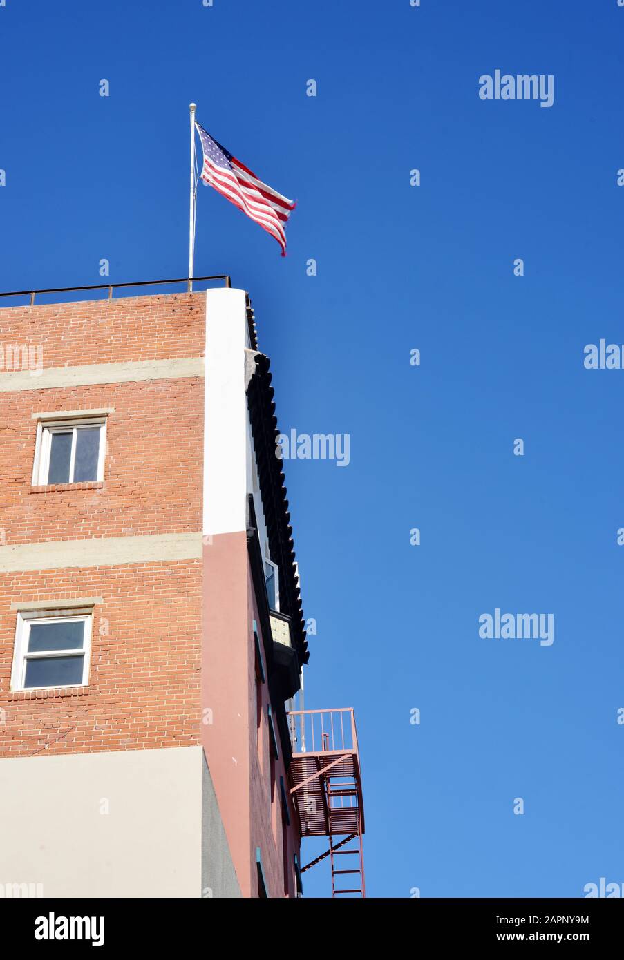American flag on a building in the USA Stock Photo - Alamy