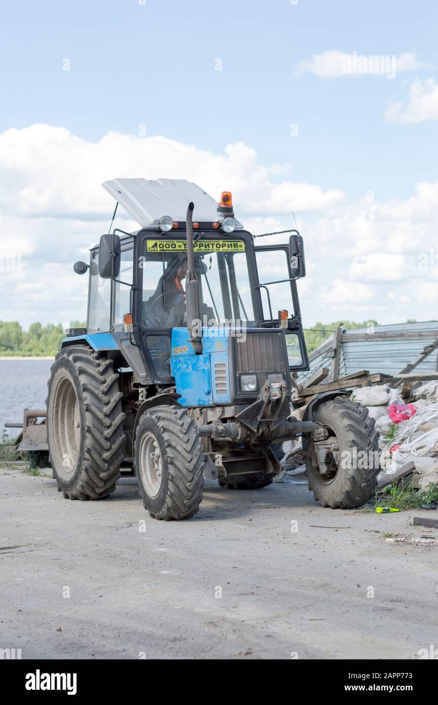 Belarus light tractor with nozzle, bucket and jackhammer, for repair