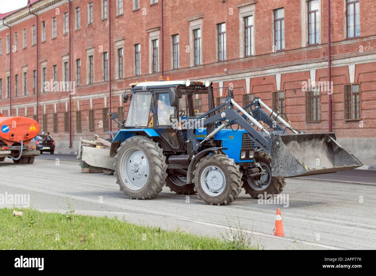 Belarus light tractor with nozzle, bucket and jackhammer, for repair