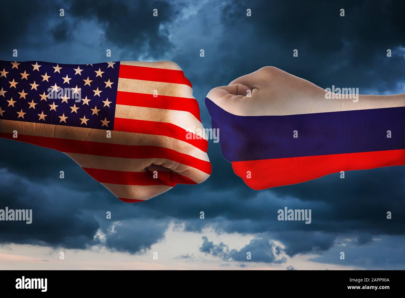 Two fists with the flags of America and Russia. The concept of confrontation between states Stock Photo