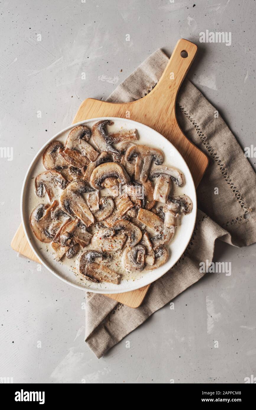 Stewed mushrooms in sour cream with portulak.Fresh mushroom stew with vegetables. Stock Photo