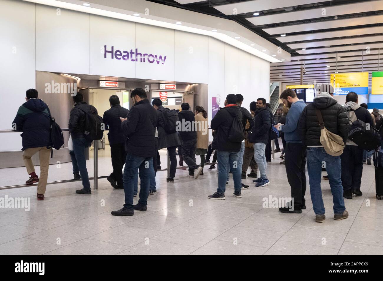 (200124) -- LONDON, Jan. 24, 2020 (Xinhua) -- People wait outside the arrivals of Heathrow Airport in London, Britain on Jan. 22, 2020. (Photo by Ray Tang/Xinhua) Stock Photo