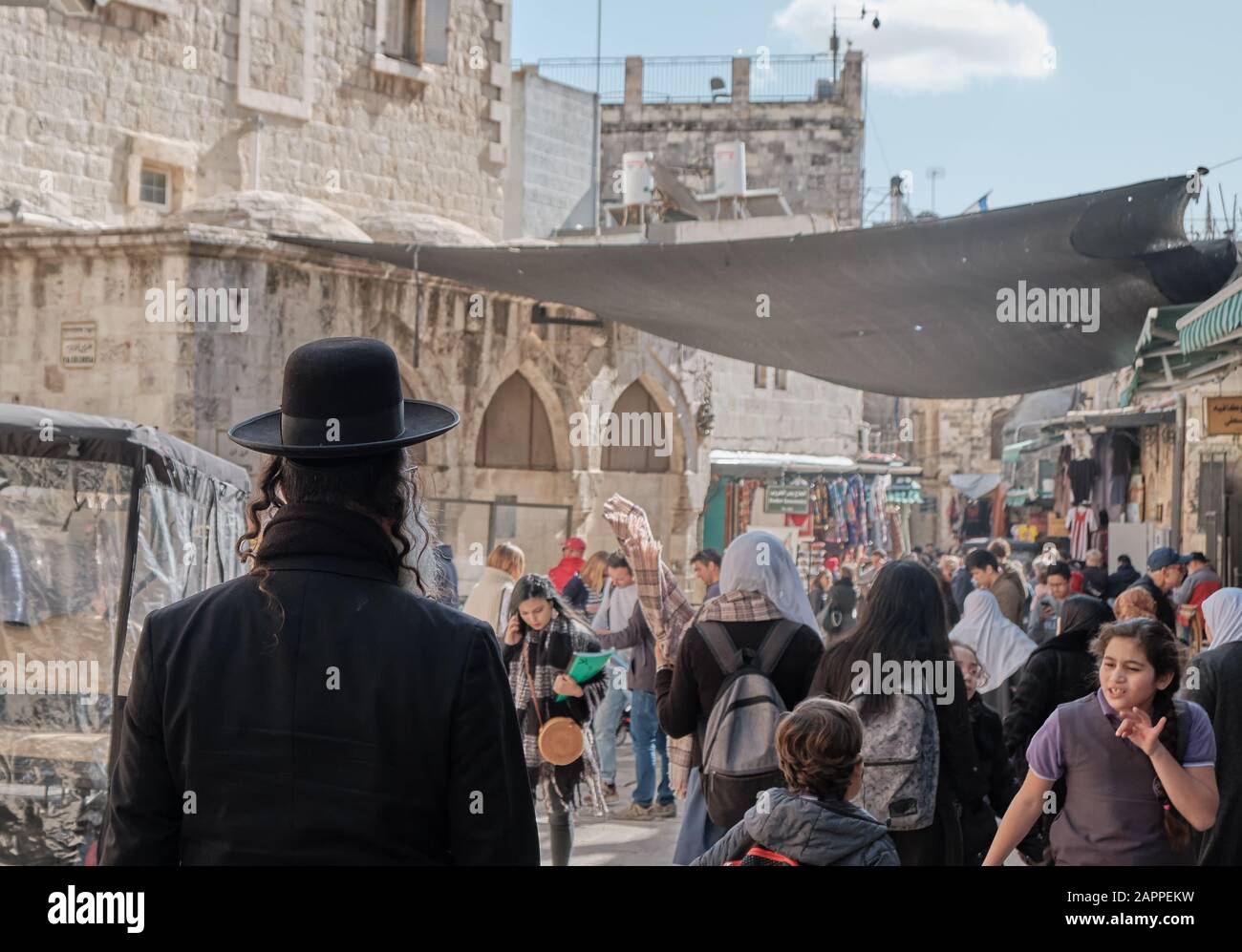 Orthodox Jews boy walking in the old city of jerusalem. DEC 2019 ISRAEL Stock Photo