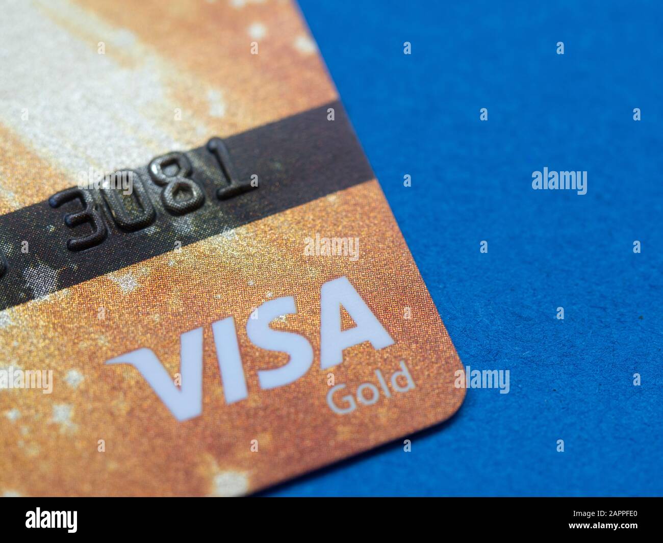 Visa Gold bank card on a dark blue background Stock Photo Alamy