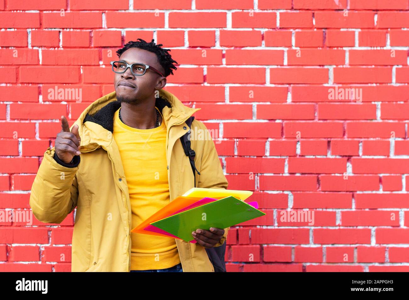 African American man trying complex decides chooses offers options Stock Photo