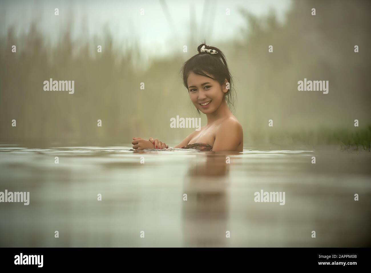 Pretty girls taking bath in japanese style onsen hot springs Stock