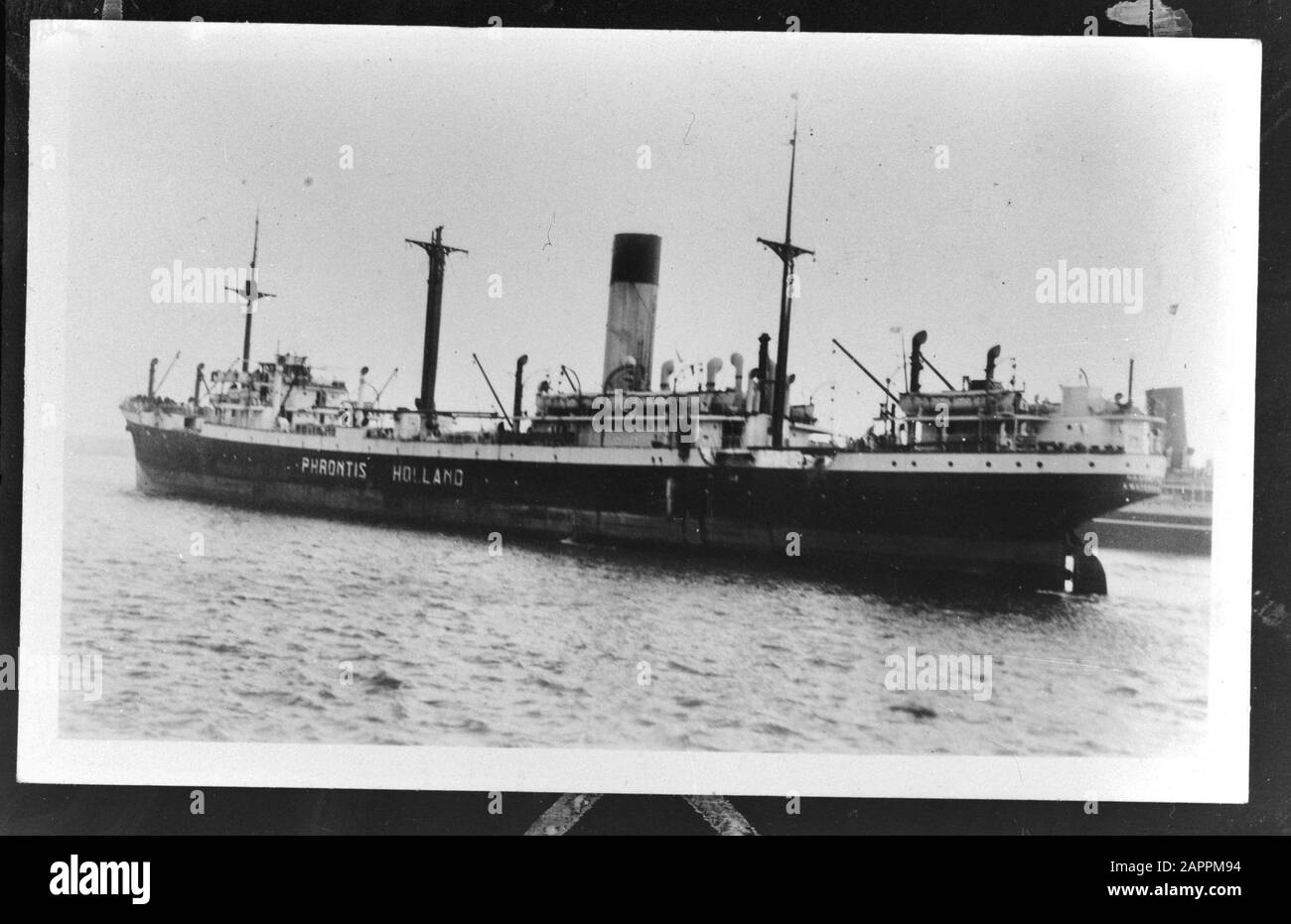 MN [Merchant Navy]/Anefo London series  Dutch merchant fleet. S.S. Phrontis Annotation: Repronegative. Built 1926 at the Caledon Shipyard, Dundee with the dimensions 136,85 x 16,66 x 8,87m, measured 6,181 GRT and 7,820 DWT. The 4,800 rhp allowed a speed of 13.5 knots. Call signs PQFR/PGSU. In 1958 sold to Djeddah and renamed and seemately renamed Ryad and the same year broken up at Hong Kong. She was owned by the Ned. Steam trip Me Ocean at Amsterdam. [source: warshipsresearch.web-log.nl/warships/2010/12/dutch-steam-ship-phrontis.html] Date: 1943 Location: Great Britain Keywords: merchant flee Stock Photo