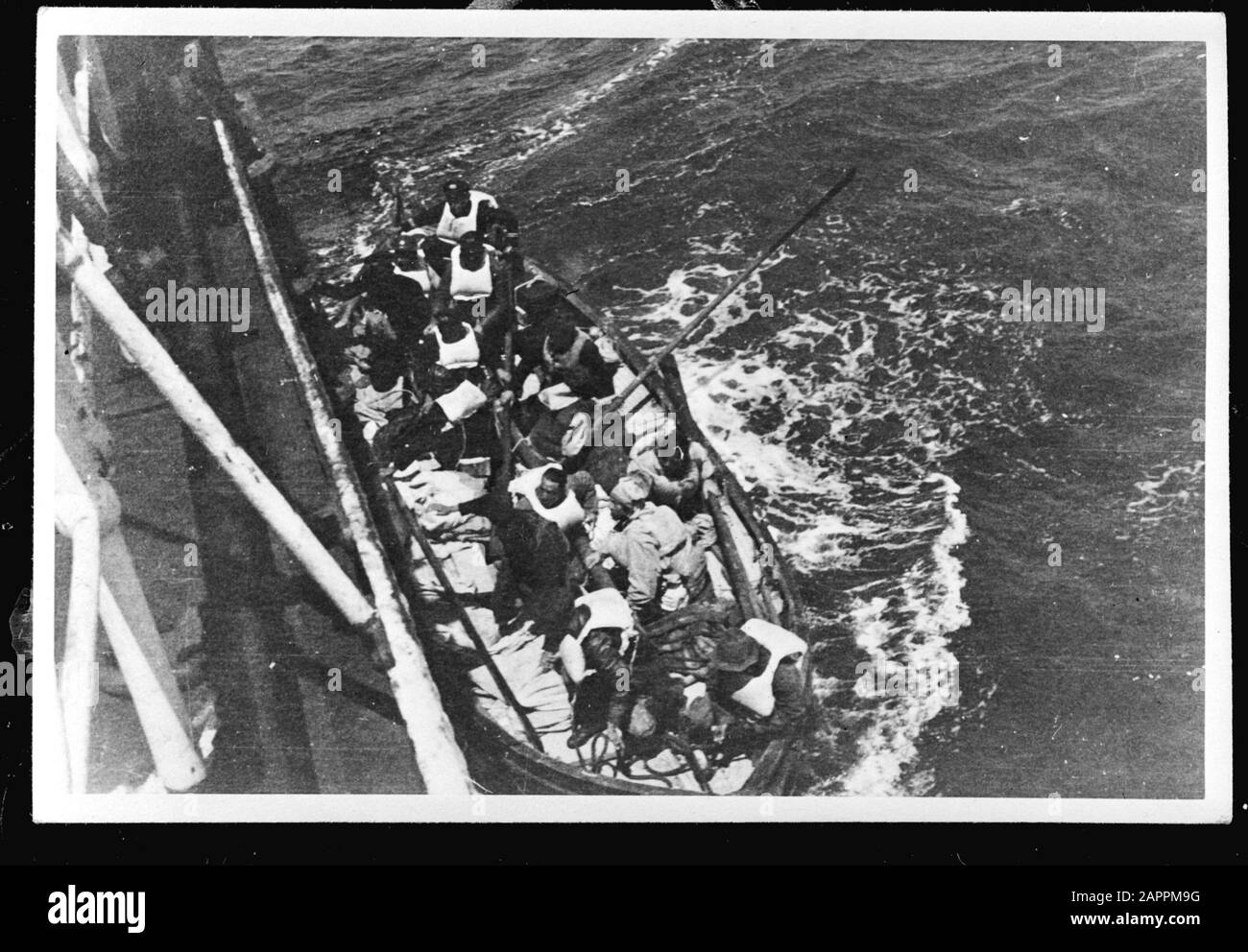 MN [Merchant Navy]/Anefo London series  Lifemagnifier with ferries Annotation: Repronegative. The Portuguese freighter ss. Maria Amelia picks up the shipwrecks from the cargo ship ss. 'Polyphemus' (1930) of the Nederlandsche Steamvaart Maatschappij 'Ocean', after the ship on its way from Sydney to England (via the Panama Canal), under Captain C. Koningstein, was torpedoed at 468 miles from New York by the German submarine 'U 578'. This killed 15 people on board. Date: 26 May 1942 Location: Great Britain Keywords: merchant fleets, navy, lifeboats, World War II Stock Photo