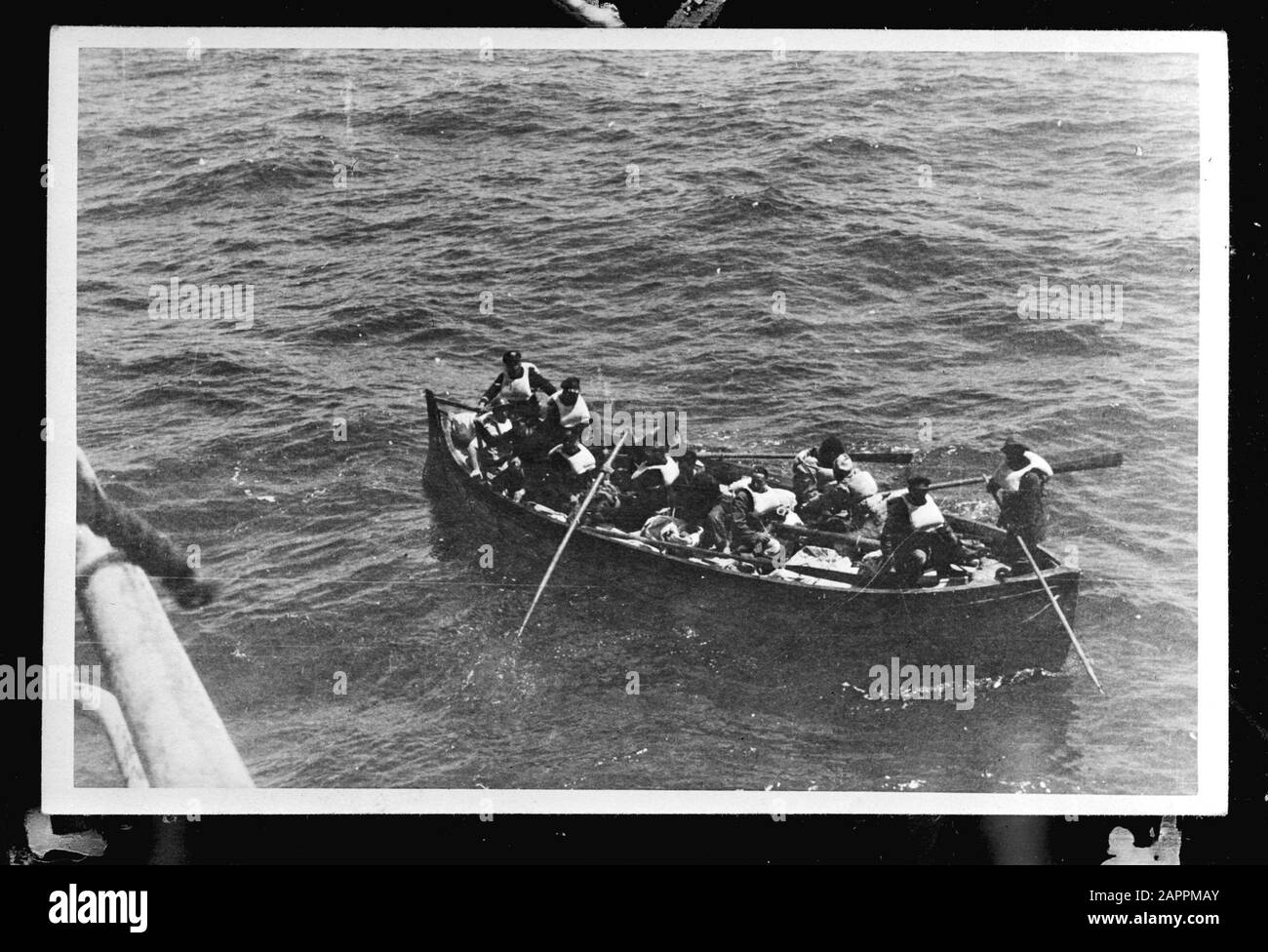 MN [Merchant Navy]/Anefo London series  Lifemagnifier with ferries Annotation: Repronegative. The Portuguese freighter ss. Maria Amelia picks up the shipwrecks from the cargo ship ss. 'Polyphemus' (1930) of the Nederlandsche Steamvaart Maatschappij 'Ocean', after the ship on its way from Sydney to England (via the Panama Canal), under Captain C. Koningstein, was torpedoed at 468 miles from New York by the German submarine 'U 578'. This killed 15 people on board. Date: 26 May 1942 Location: Great Britain Keywords: merchant fleets, navy, lifeboats, World War II Stock Photo
