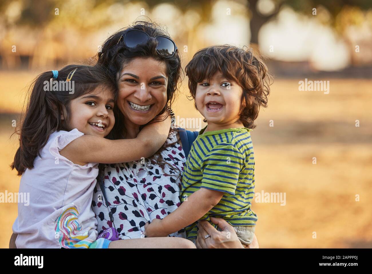 Portrait of happy mother and children Stock Photo