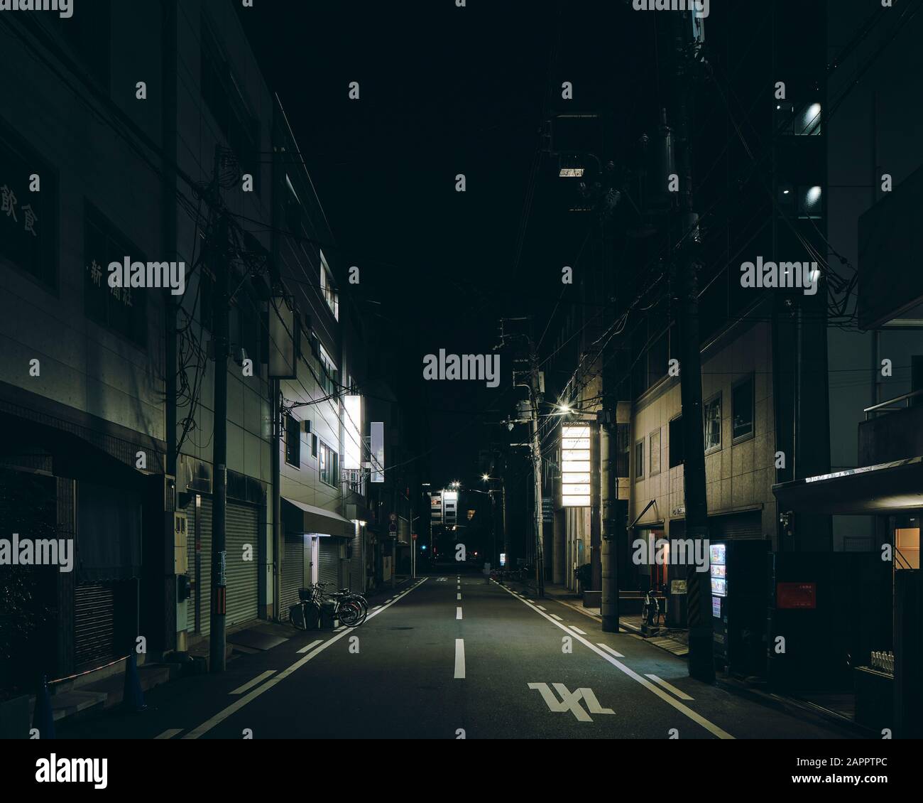 Night scene of a street with retail buildings, Osaka, Japan Stock Photo