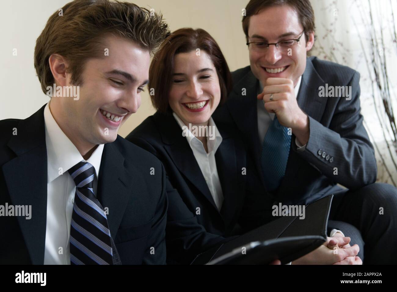View of business people smiling Stock Photo - Alamy