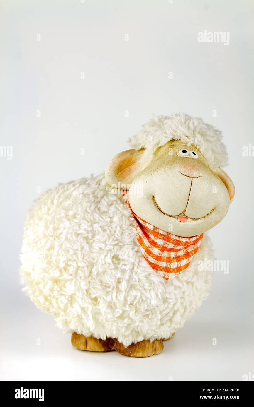 Plush sheep toy with a naughty smile.Selective focus with shallow depth of field. Stock Photo