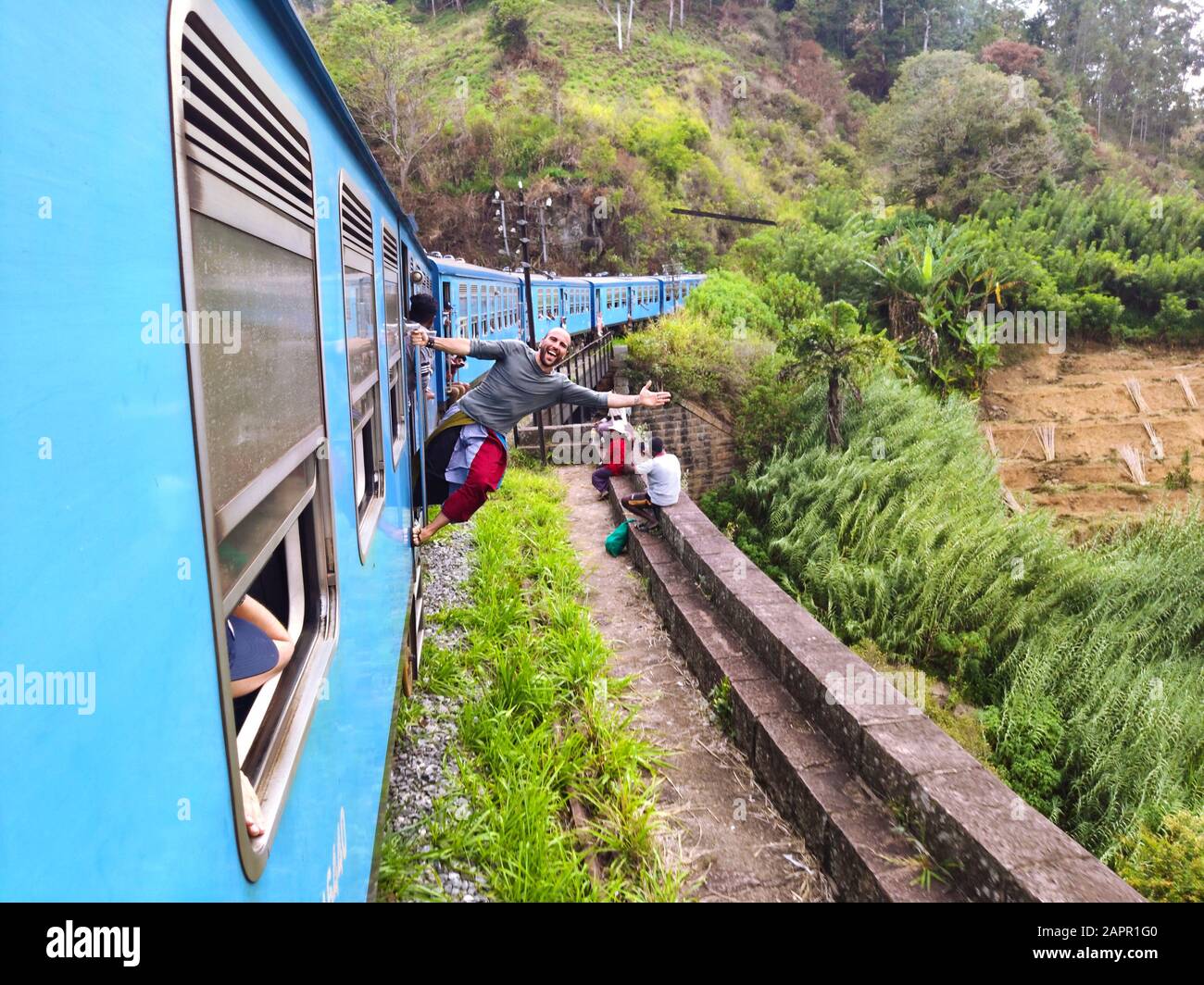 Nuwara Eliya, Sri Lanka, February 9, 2019: Tourists on the train from Kandy to Nuwara Eliya, outside the window. One of the best ways to reach to trav Stock Photo