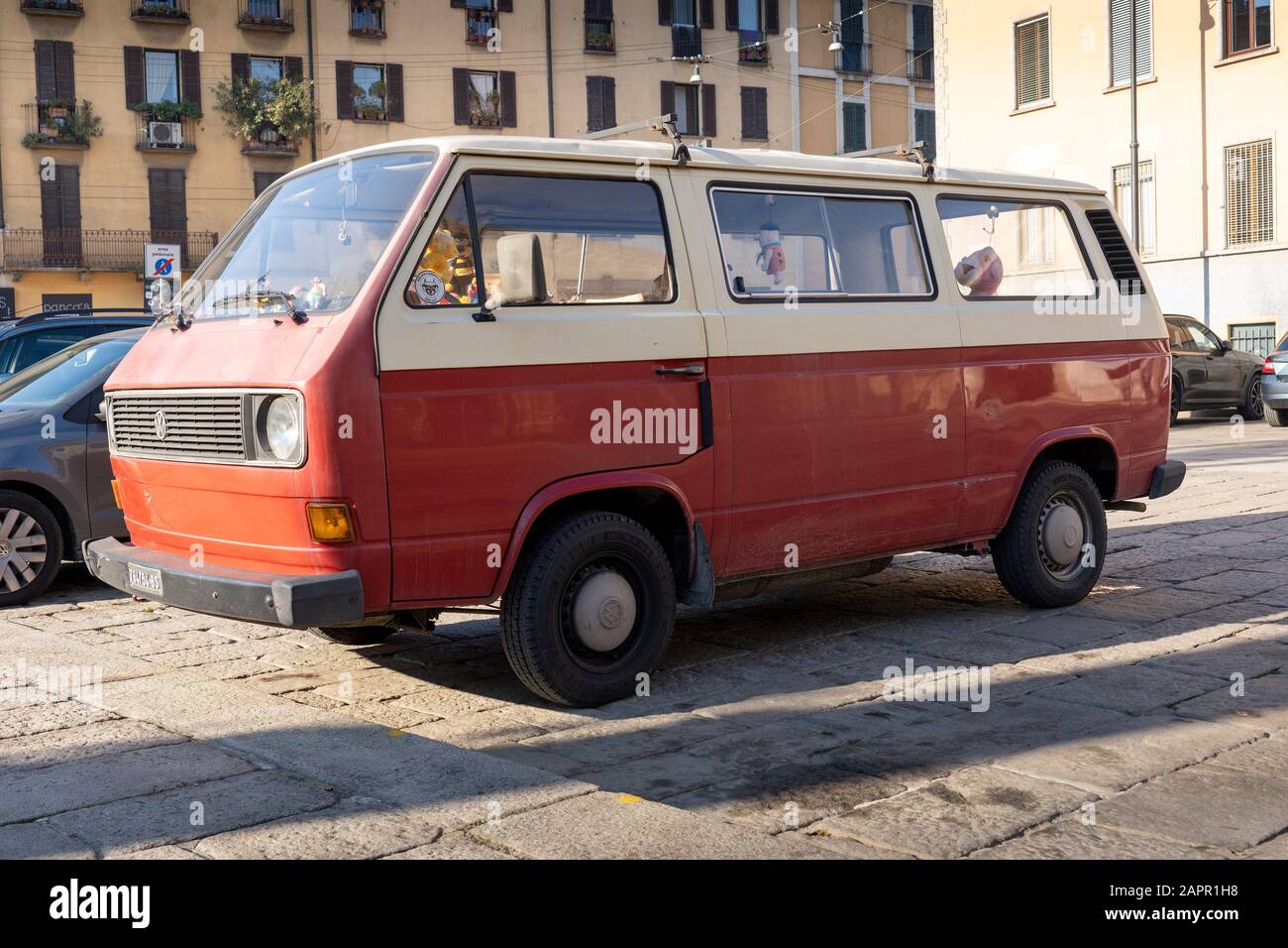 Red and white vintage Volkswagen camper van. VW transporter microbus. Stock Photo
