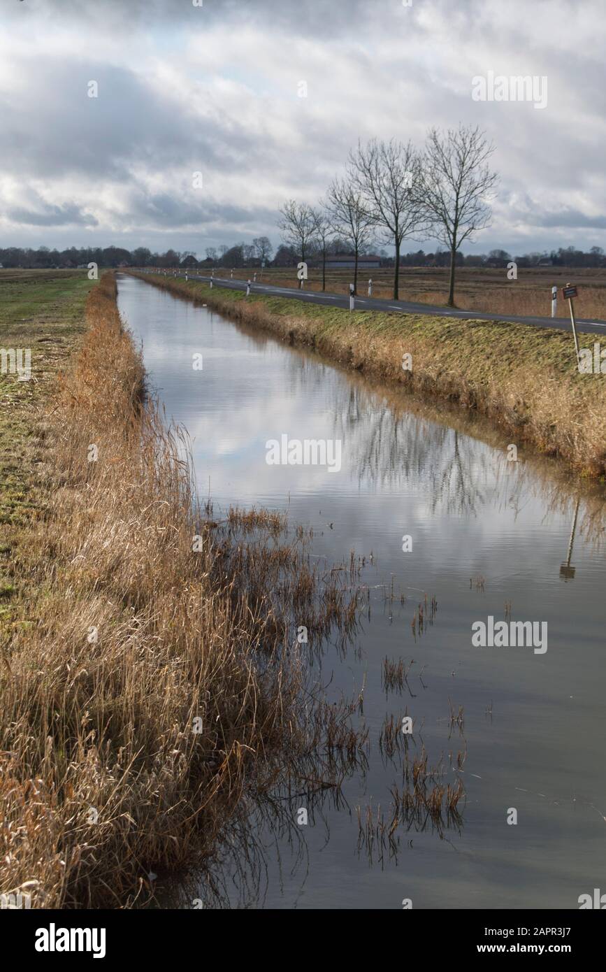 Canal on the remote and isolated Dollart moorland in East Frisia, Niedersachsen, North Germany Stock Photo