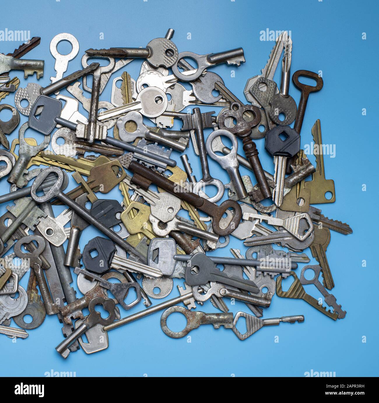 Keys set on blue background. Door lock keys and safes for property ...