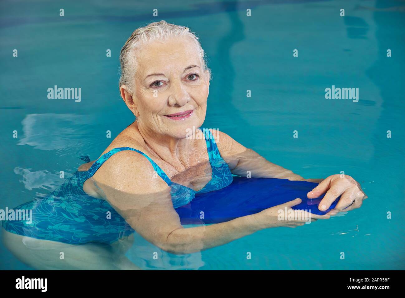 Senior woman swimming in sea hi-res stock photography and images - Alamy