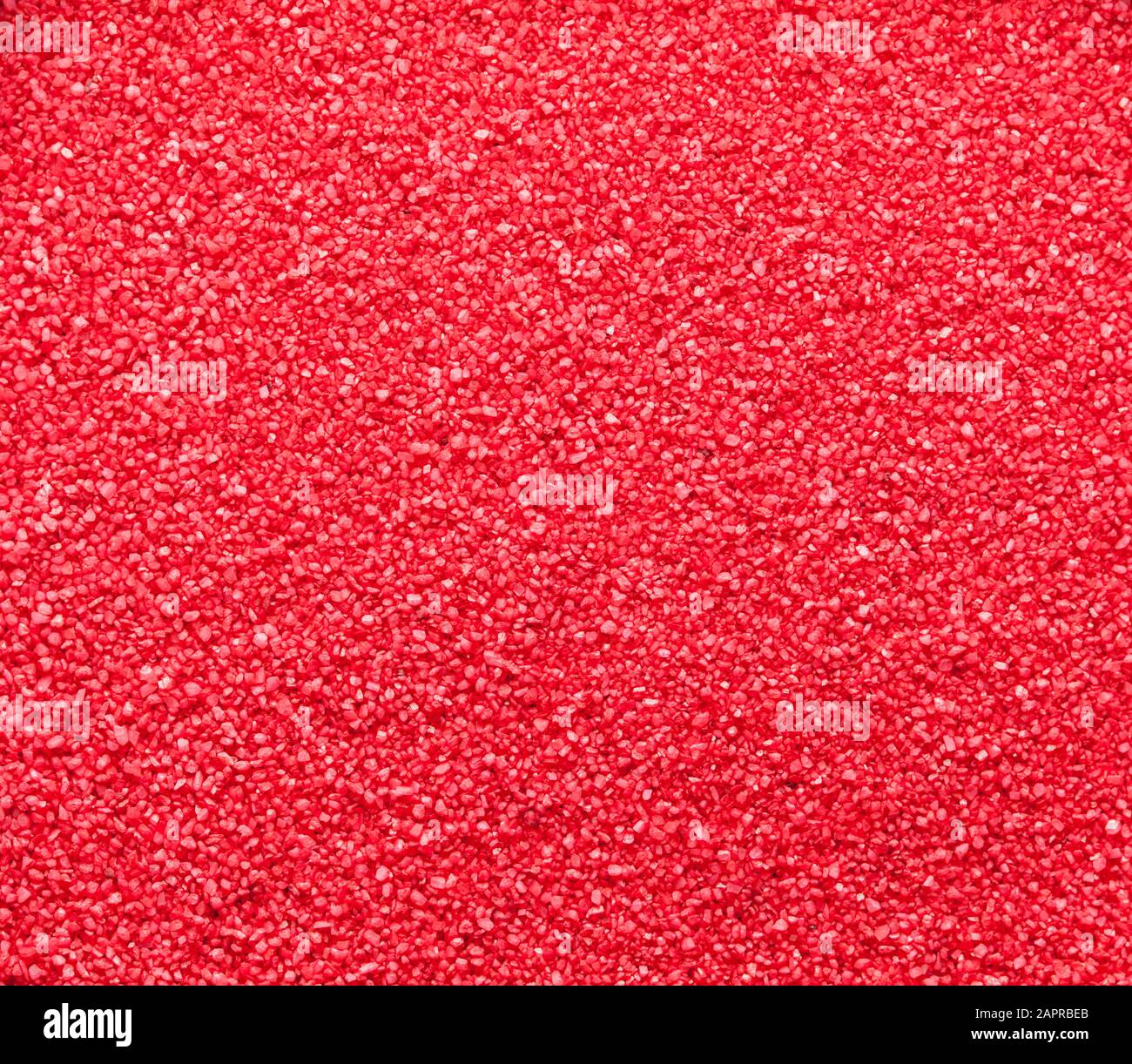 Small Bright Red Fish Tank Gravel Background. Stock Photo