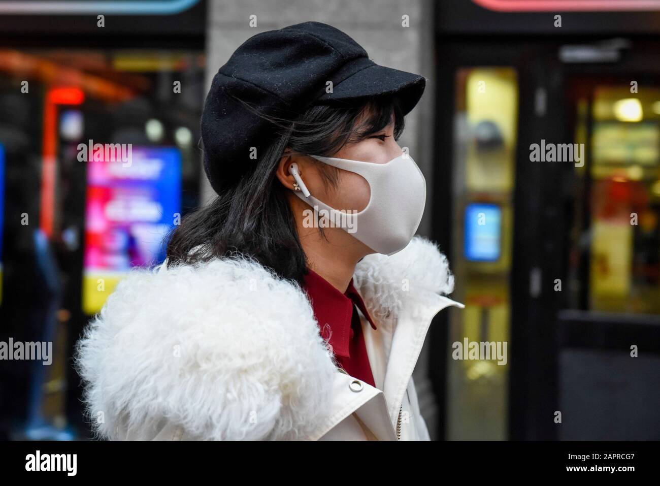 London, UK.  24 January 2019. A woman wears a facemask, possibly in reaction to the outbreak of the coronavirus in Wuhan, China, in Chinatown ahead of Chinese New Year, the Year of the Rat.   Credit: Stephen Chung / Alamy Live News Stock Photo