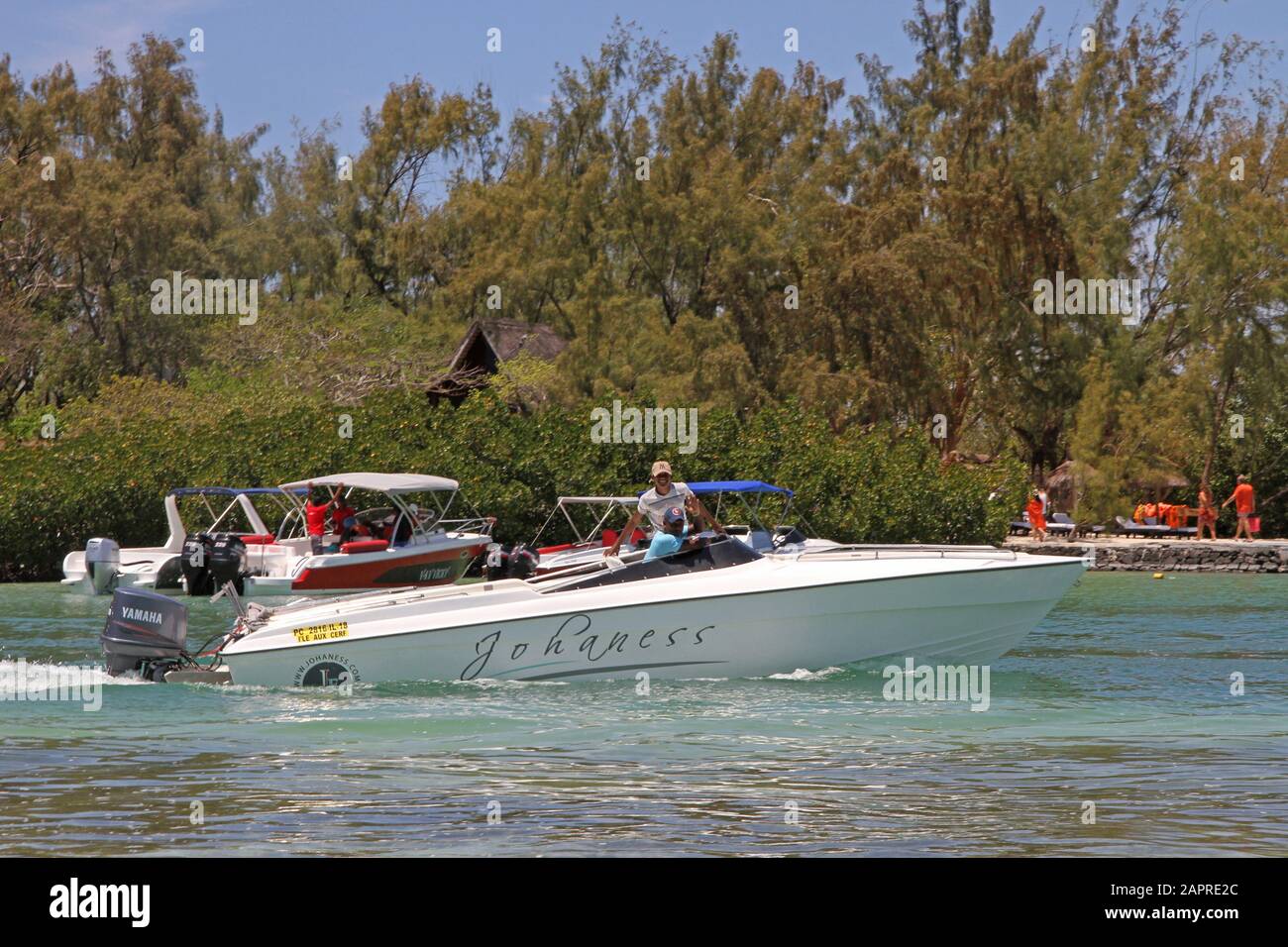 Mangroves and motorboats off the Coast of Mauritius. Stock Photo