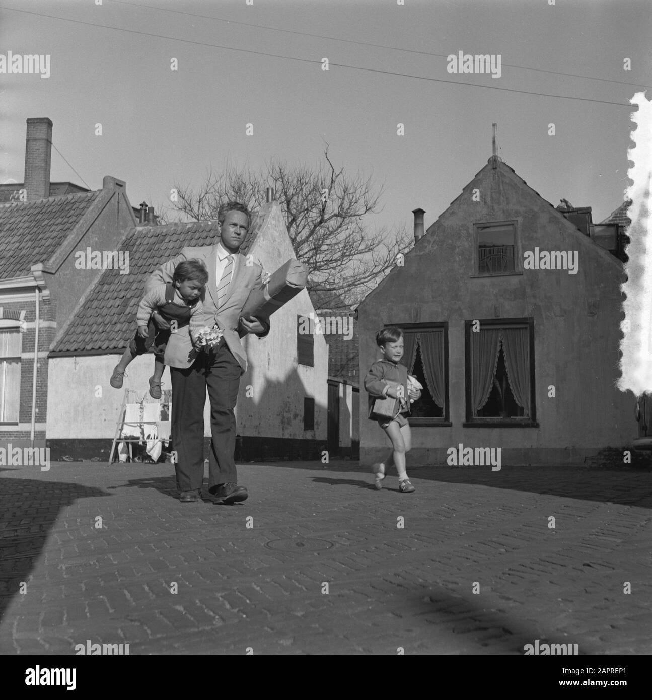Children with gifts for Mother's Day Date: 11 May 1956 Keywords: GIFTS,  Children, Mother's Day Institution Name: Mother's Day Stock Photo - Alamy