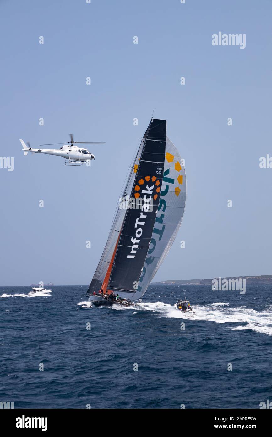 Sydney to Hobart Yacht Race 2019. Infotrack Supermaxi yacht at the start of the race leaving the heads of Sydney harbour. Rolex Sydney Hobart. Stock Photo