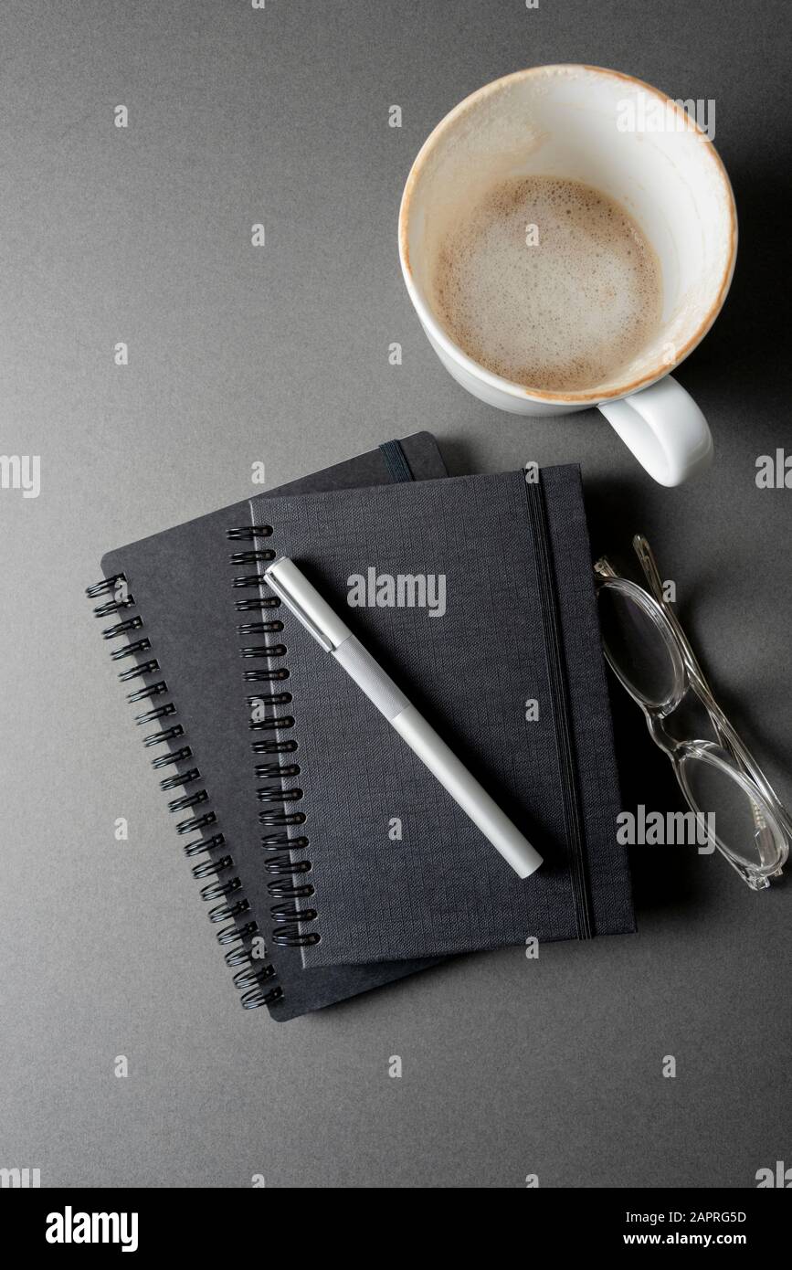 Two black note pads on a grey desk top. January 2020. Please credit: Phillip Roberts Stock Photo